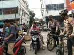 Personel Sat Samapta Polres Asahan Patroli Bersepeda Imbau Warga Terapkan Prokes